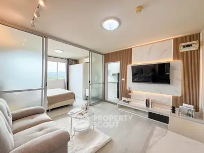 Modern open-plan living room with stylish decor and natural light