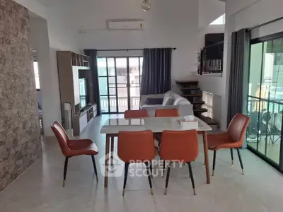 Spacious modern dining area with stylish furniture and natural light