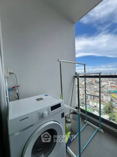 High-rise balcony with washing machine and stunning city view