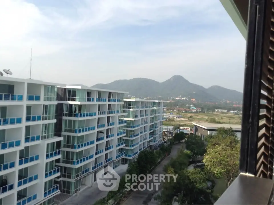 Modern apartment buildings with mountain view in serene setting