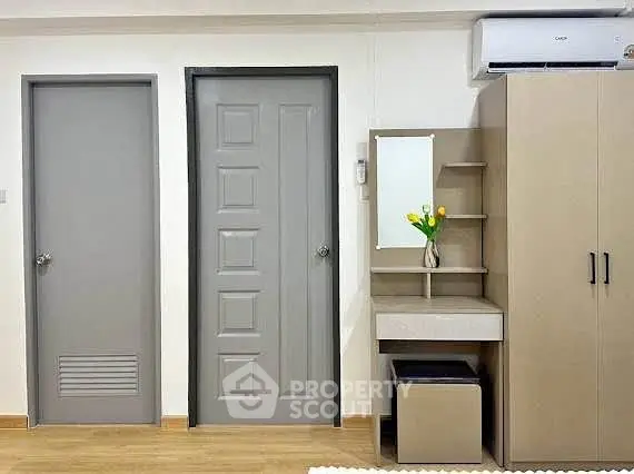 Modern bedroom with sleek furniture and air conditioning unit