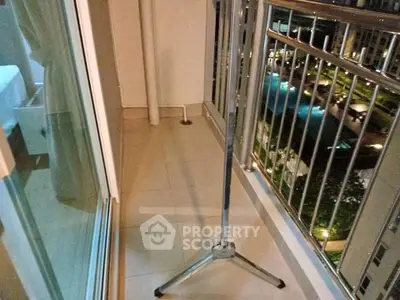 Cozy balcony with pool view in modern apartment complex