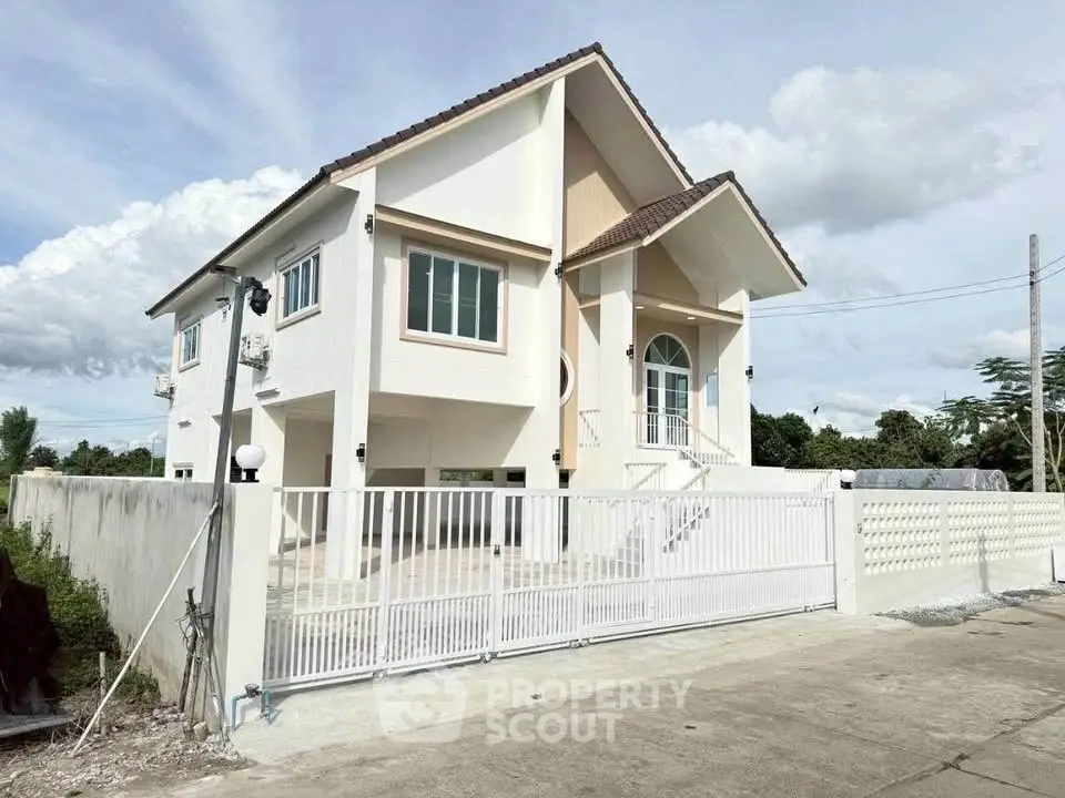 Stunning modern two-story house with spacious driveway and gated entrance