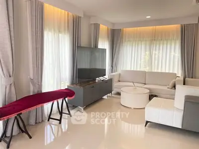 Spacious modern living room with elegant furniture and large windows