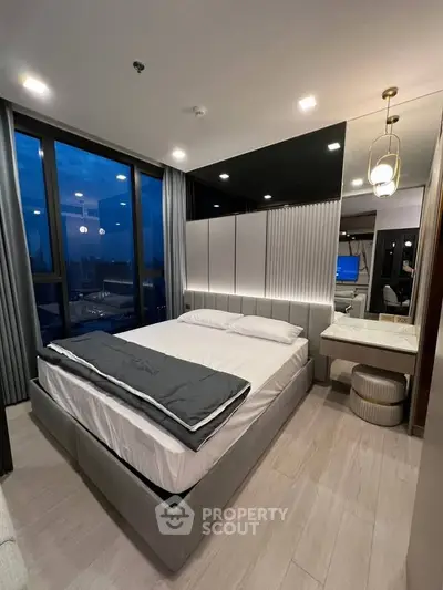 Luxurious modern bedroom with stunning city view and elegant decor
