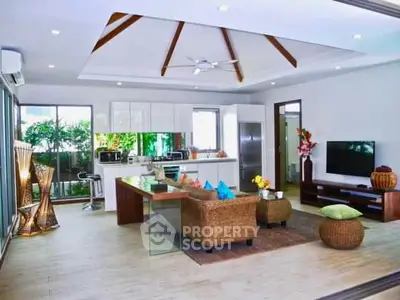 Spacious modern living room with open kitchen and stylish decor