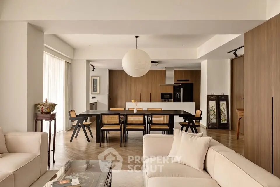 Spacious modern living room with open kitchen and elegant dining area