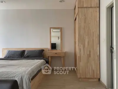 Modern bedroom with wooden furniture and minimalist design