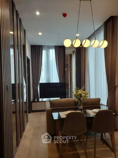 Modern living room with elegant dining area and stylish lighting