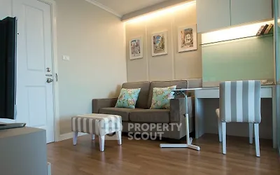 Charming living room with cozy sofa and stylish decor in modern apartment.