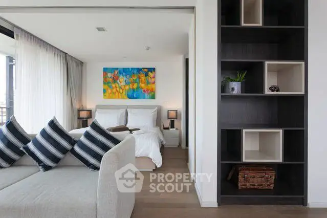 Modern bedroom with stylish decor and cozy seating area