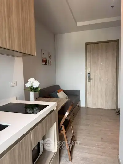 Modern compact living room with stylish decor and wooden accents