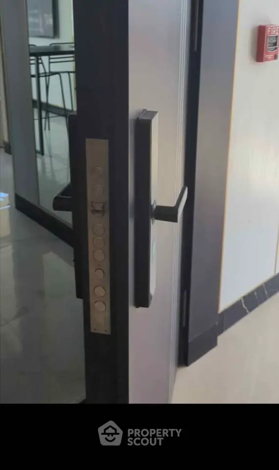 Modern office entrance with sleek door handle and security features