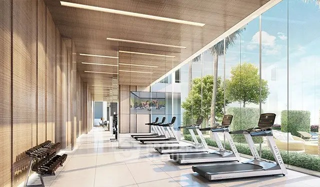 Luxurious modern gym with state-of-the-art equipment and floor-to-ceiling windows offering garden views.