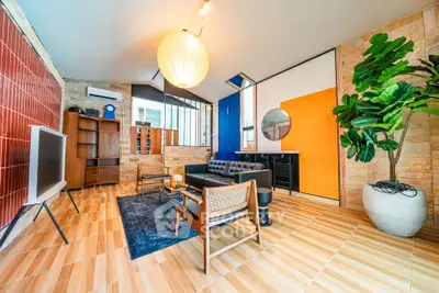 Stylish modern living room with vibrant decor and spacious layout