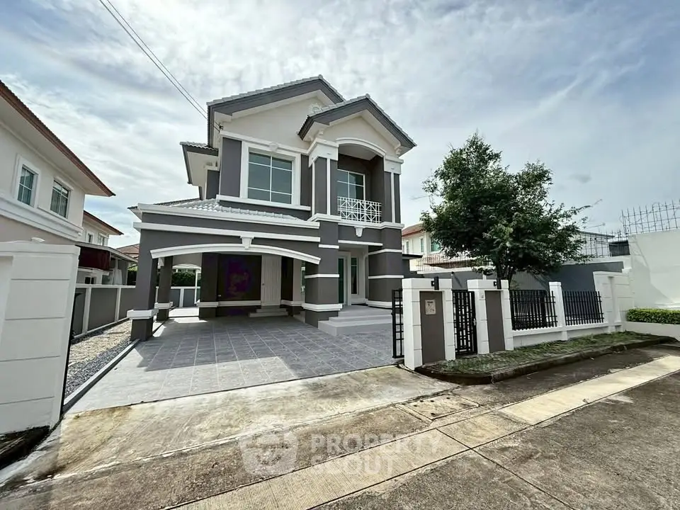 Elegant two-story house with modern facade and spacious driveway