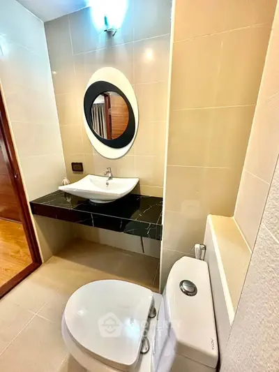Modern bathroom with sleek fixtures and stylish mirror design