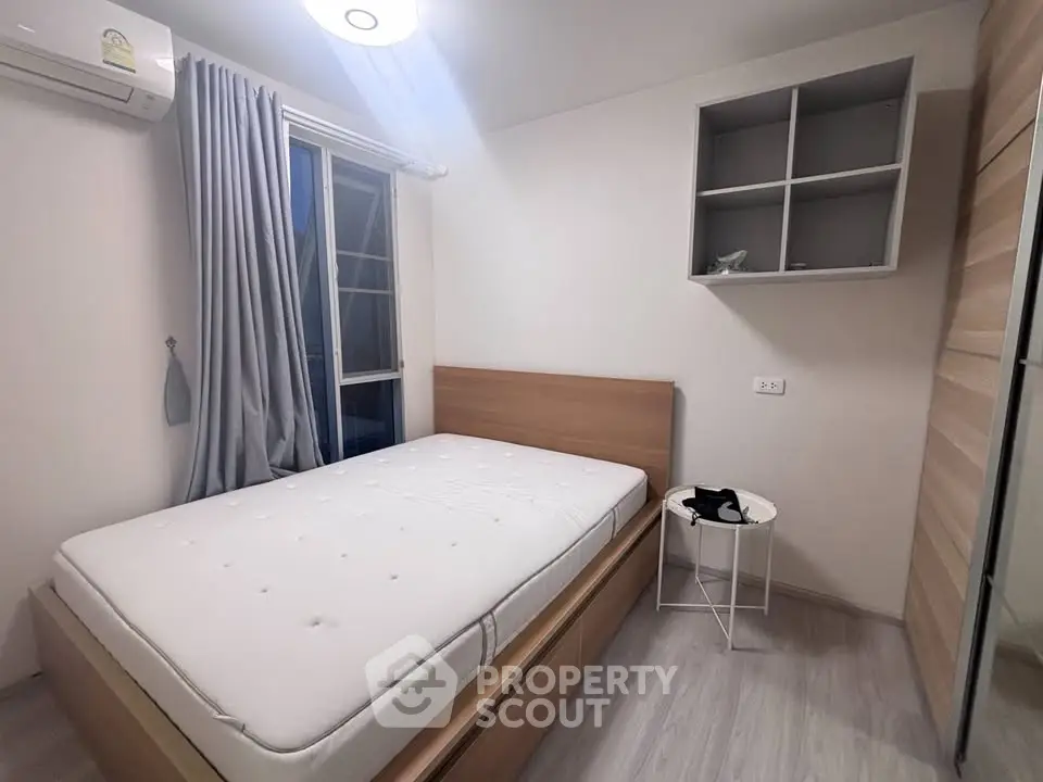 Modern bedroom with minimalist design, featuring a cozy bed, stylish curtains, and ample storage space.