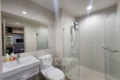 Modern bathroom with glass shower and sleek fixtures