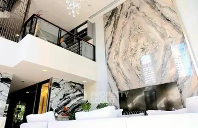 Luxurious living room with stunning marble feature wall and modern decor