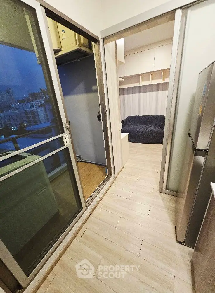 Compact modern apartment with balcony and sleek kitchen design