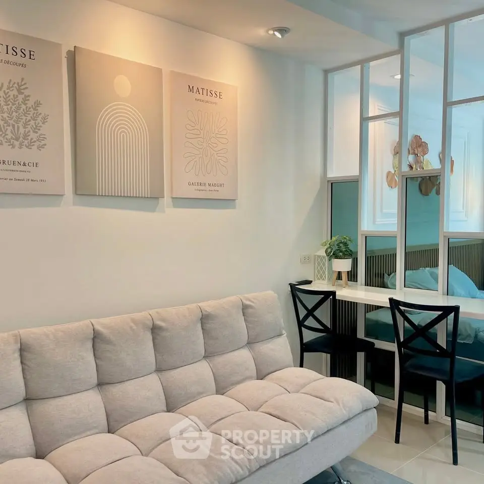 Stylish modern living room with cozy sofa and elegant wall art