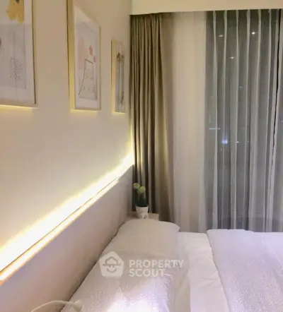 Cozy bedroom with elegant lighting and modern decor