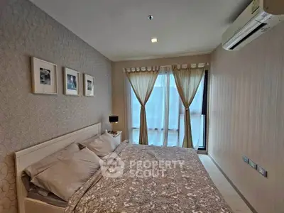 Elegant bedroom with stylish decor and large window for natural light