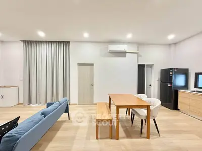 Spacious modern living room with dining area and minimalist decor