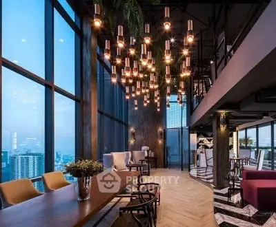 Luxurious high-rise building interior with stunning city views and elegant lighting.