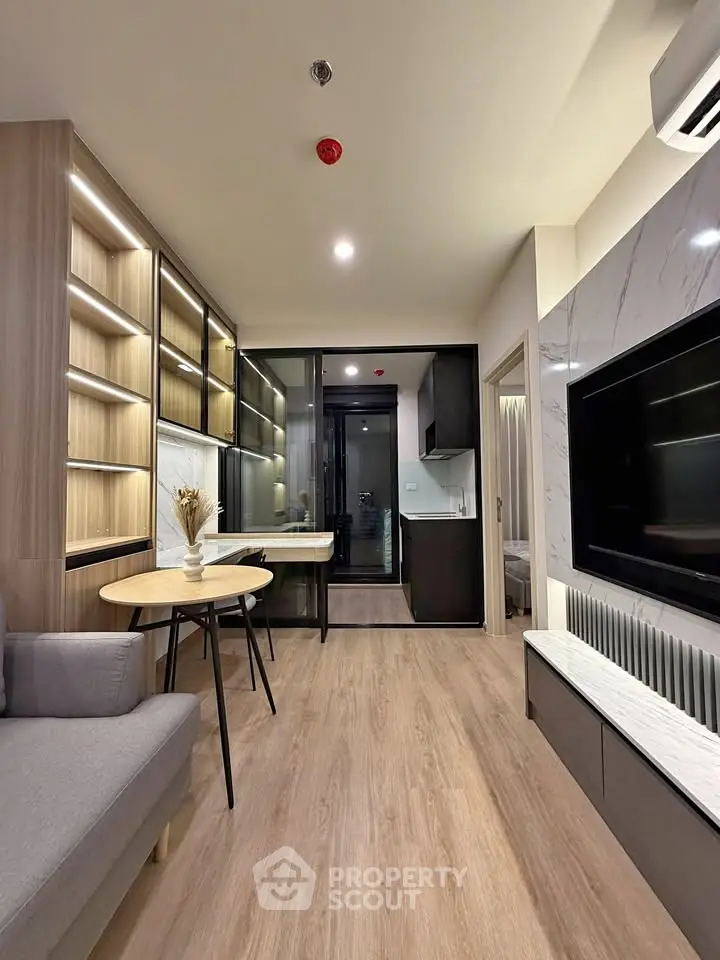 Modern living room with sleek design, open layout, and stylish furniture in a contemporary apartment.