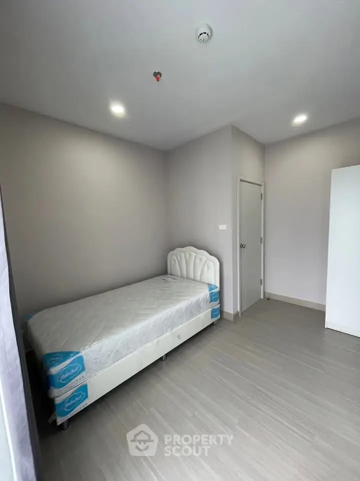 Minimalist bedroom with single bed and modern decor