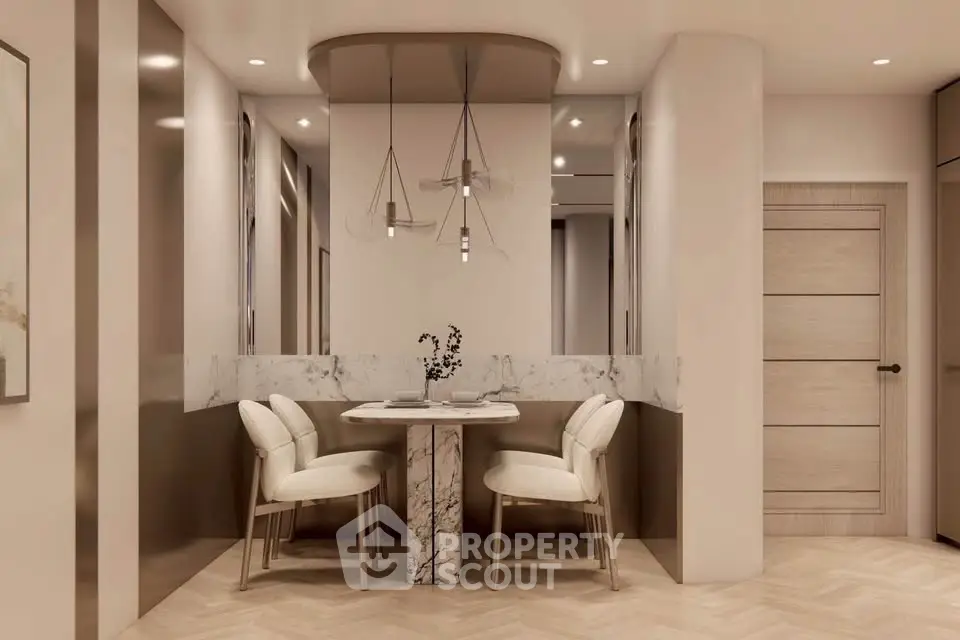 Elegant dining nook with marble table and modern lighting in a stylish interior.