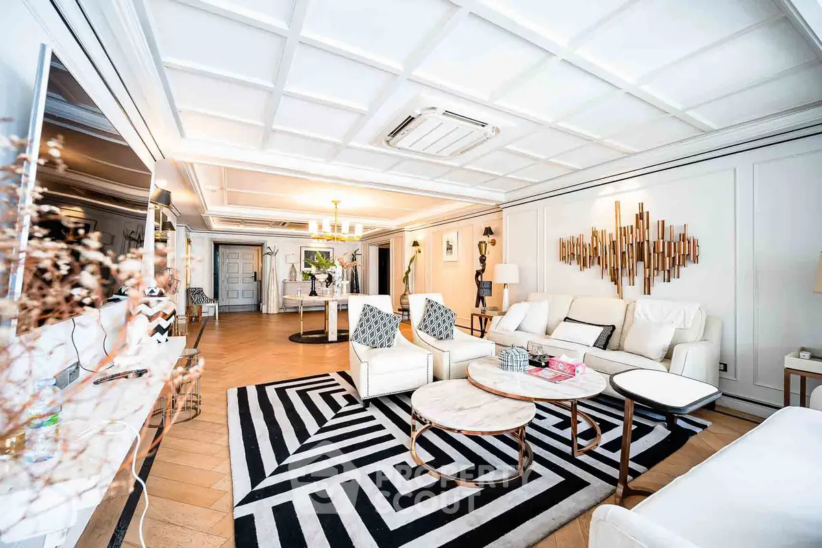 Luxurious and spacious living room with elegant decor and modern furniture, featuring a stylish ceiling design.