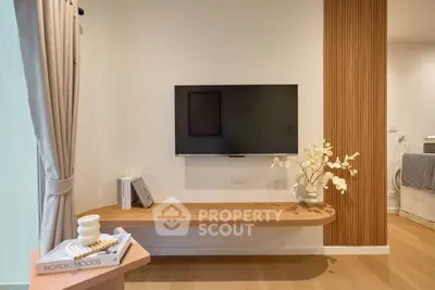 Modern living room with wall-mounted TV and stylish wooden decor