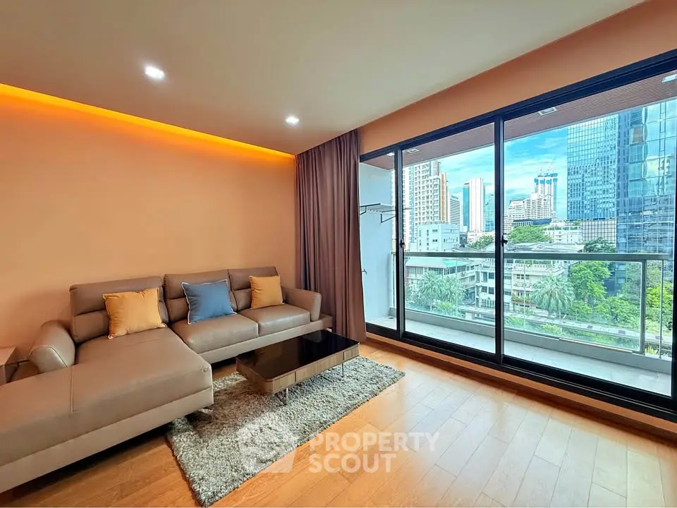 Modern living room with city view and spacious balcony in luxury apartment