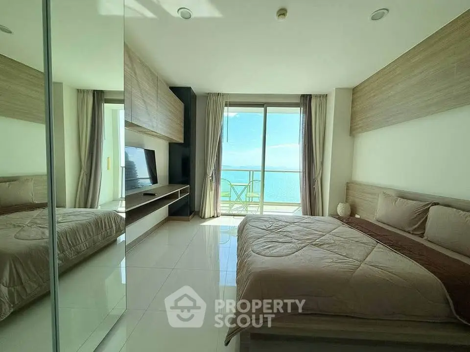 Luxurious bedroom with stunning ocean view and modern decor