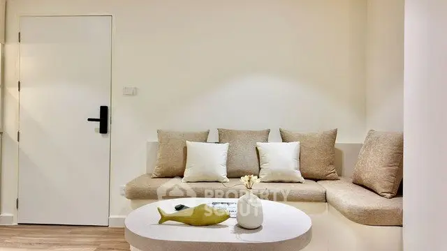 Modern minimalist living room with cozy seating and stylish decor