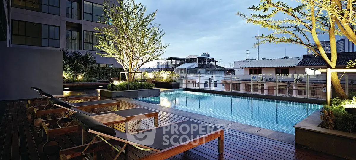 Luxurious rooftop pool with city views and modern lounge chairs, perfect for relaxation and entertainment.