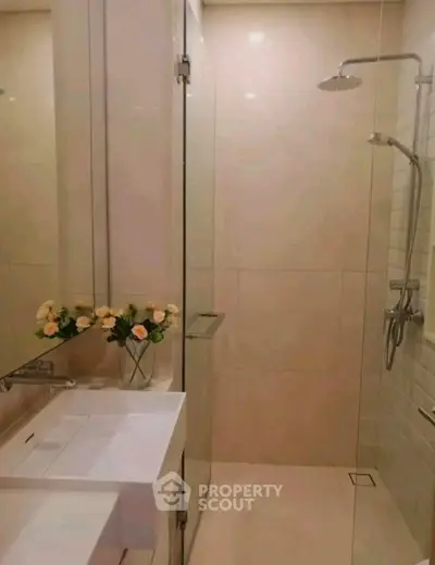 Modern bathroom with glass shower and elegant sink design