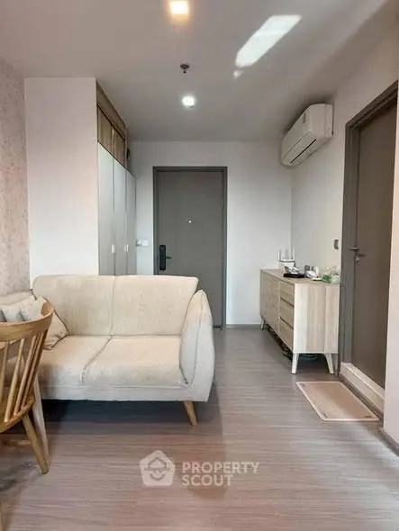 Modern living room with stylish furniture and air conditioning in a cozy apartment.