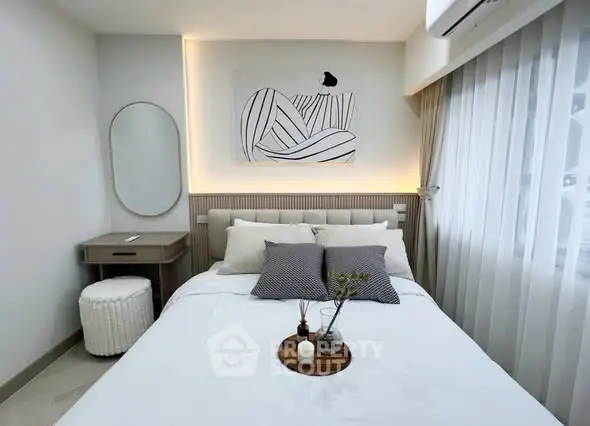 Modern bedroom with stylish decor, featuring a cozy bed, elegant artwork, and soft lighting for a serene ambiance.