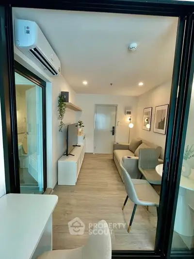 Modern living room with stylish furniture and air conditioning in a cozy apartment.