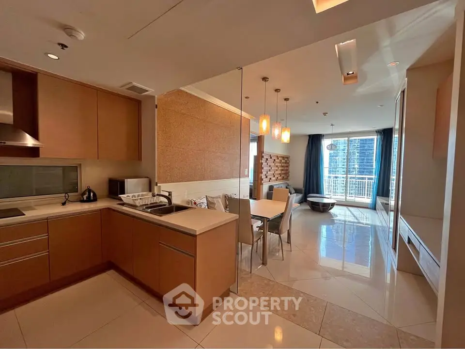 Modern open-layout kitchen and dining area with sleek design and city view.