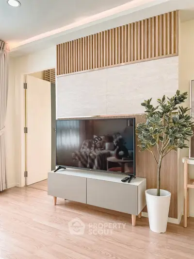 Modern living room with stylish TV setup and elegant decor