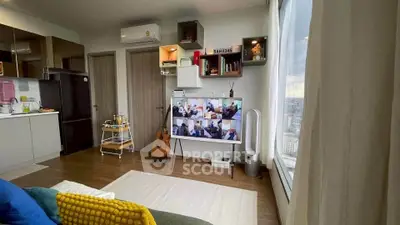 Modern living room with large window, cozy decor, and city view