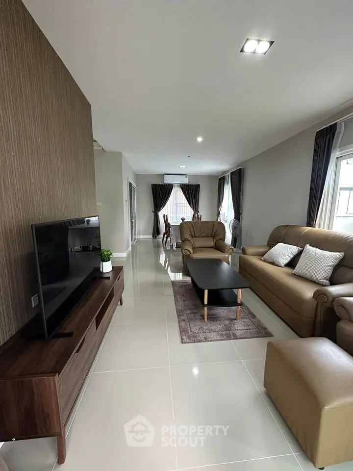 Spacious modern living room with elegant decor and natural light