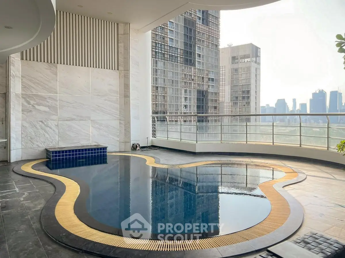 Luxurious rooftop pool with stunning city skyline view in modern high-rise building.