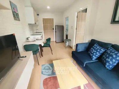 Modern living room with stylish furniture and open kitchen layout