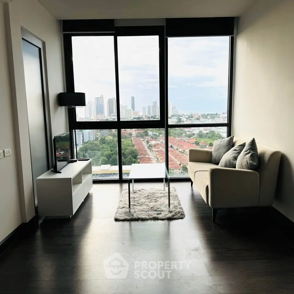 Modern living room with stunning city view and sleek furnishings